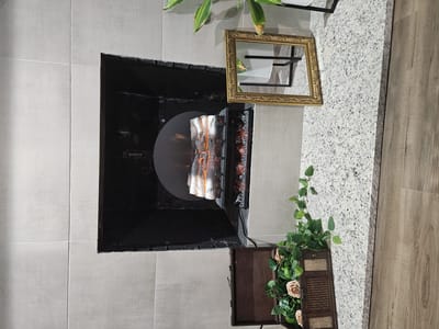 Stylish interior fireplace with decorations