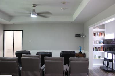 Bright common area with seating and bookshelves