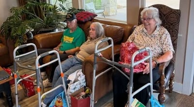 Residents sitting in a cozy common area during an event