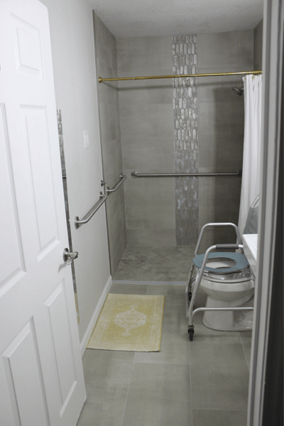 Accessible bathroom with grab bars and shower