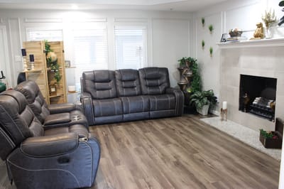 Cozy sitting area with comfortable recliner sofas and plants