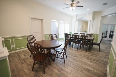 Interior view of a shared dining area with wooden tables
