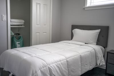 Cozy resident room with a bed and closet