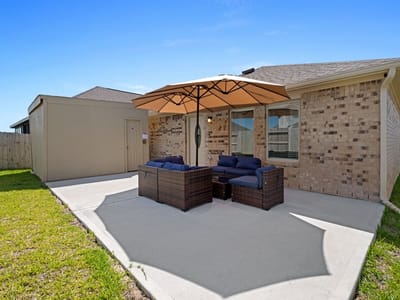 Outdoor seating area with patio umbrella