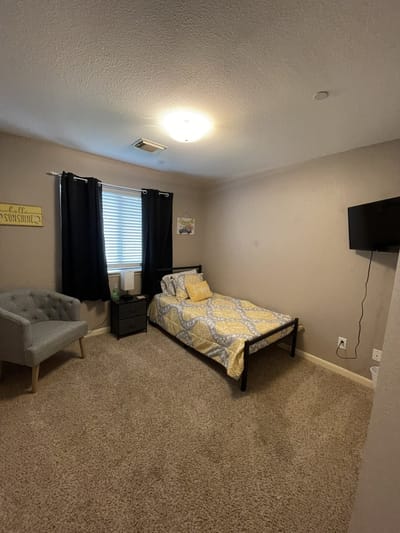 Cozy private room with a bed and TV