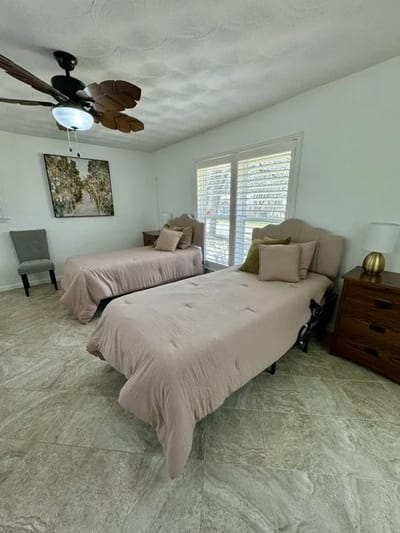 Private resident room with twin beds and natural light