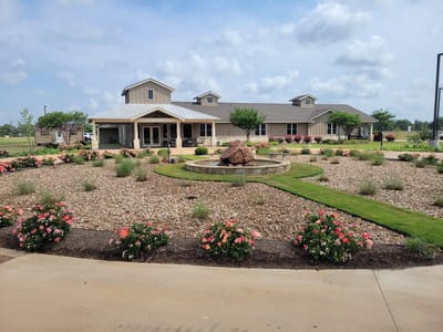 Exterior view of the assisted living facility with garden