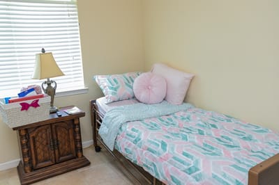 Cozy private bedroom with a bed and lamp