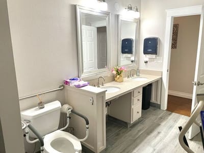 Brightly lit restroom with accessible features