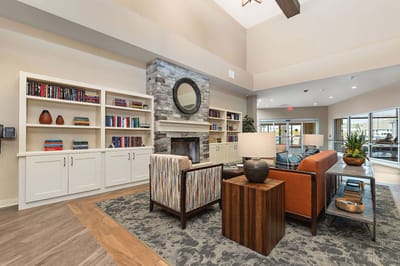 Cozy common area with seating and bookshelves