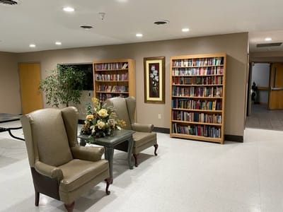 Common area with seating and bookshelves