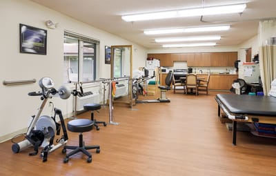 Rehabilitation room with equipment and seating