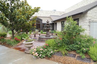 Beautiful outdoor space with a fountain and flowers