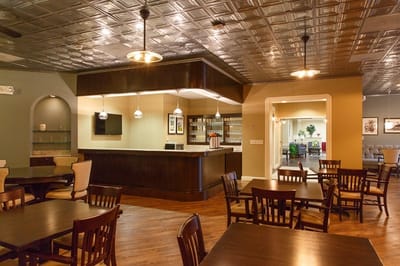 Bright dining room with wooden tables and chairs