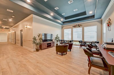Bright common area with seating and windows