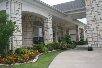 Exterior view of a well-maintained assisted living entrance