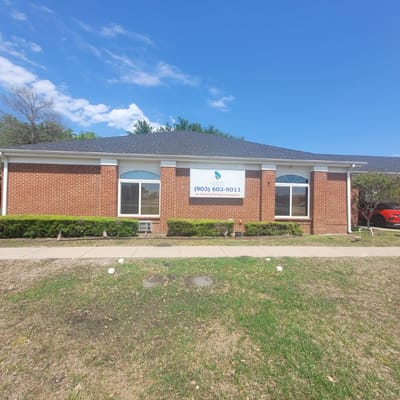 Exterior view of a brick senior living facility building