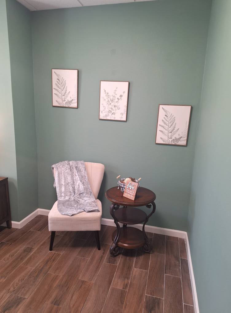 Cozy corner with a chair and wall art in a calming room