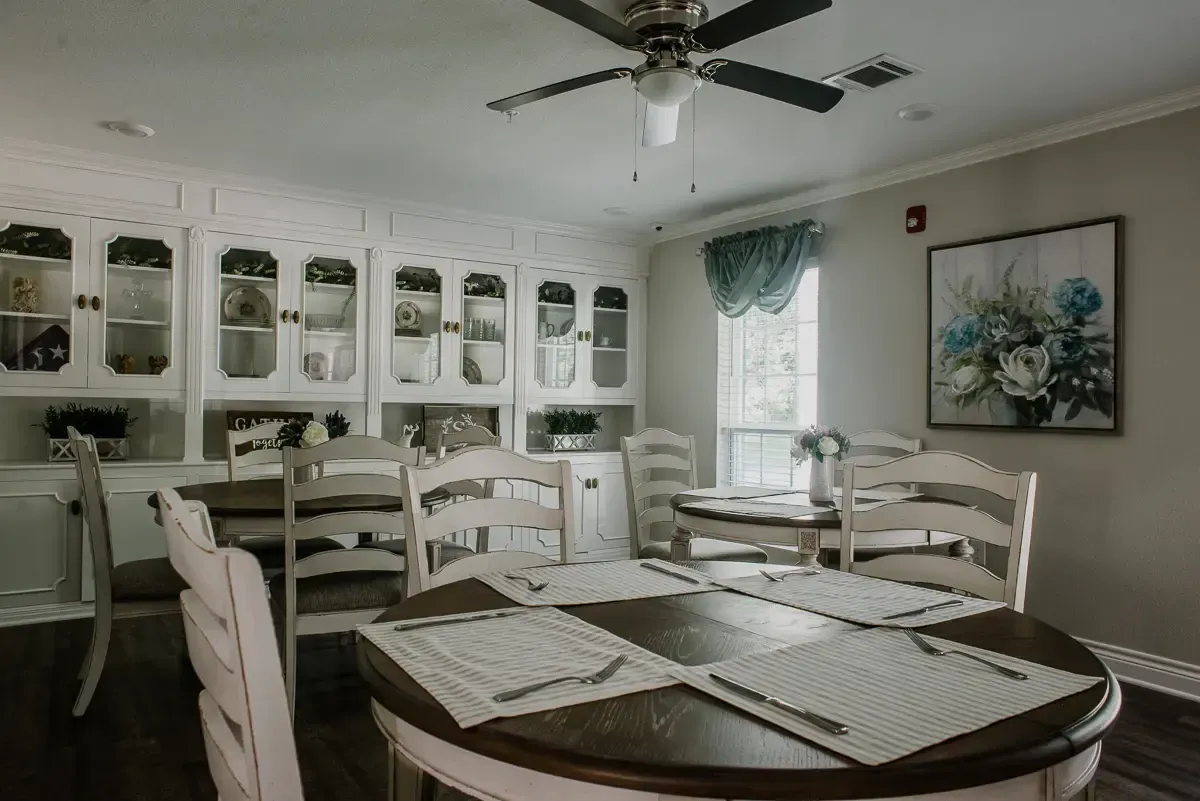 Bright dining area with tables and floral decor