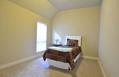 Private resident room with a bed and window