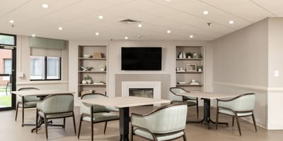 Bright common area with tables and chairs