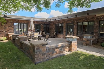 Outdoor seating area with tables and chairs