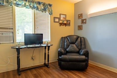 Cozy private room with chair and TV