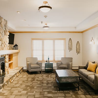 Cozy common area with comfortable seating and a fireplace
