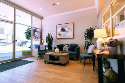 Lobby area with seating and plants.