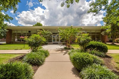 Front view of the facility with landscaped entrance