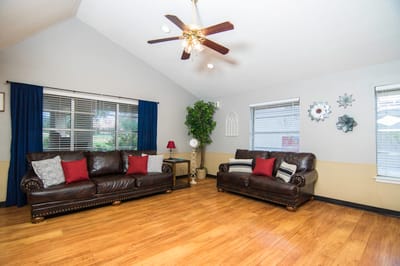 Cozy common area with leather sofas and natural light