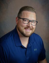 North Big Horn Hospital District, Nursing Home in Douglas, WY — Smiling man in a blue polo shirt with glasses