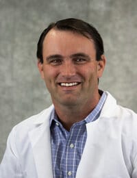 North Big Horn Hospital District, Nursing Home in Douglas, WY — Smiling healthcare professional in a white coat