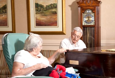 Hunterdon Care Center, Nursing Home in Flemington, NJ — Elderly residents interacting near a grand piano