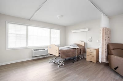 A private resident room with a hospital bed