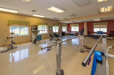 Physical therapy room with exercise equipment