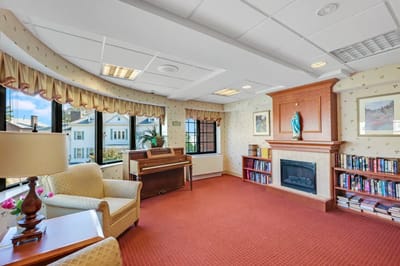 Comfortable common area with seating and bookshelves
