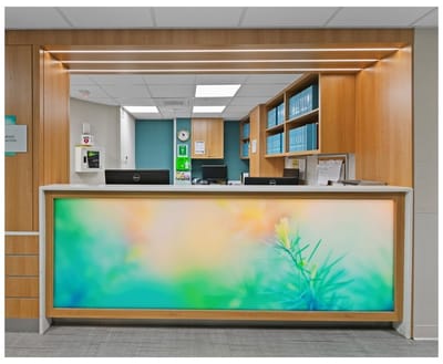 Front desk of a bright, welcoming facility lobby