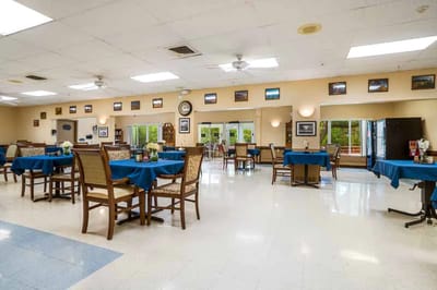 Dining area with tables and chairs in a care facility