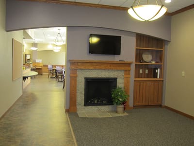 Interior view of a common area with a fireplace