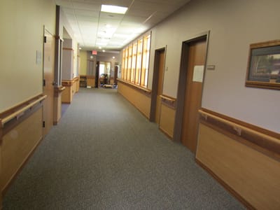 A wide hallway inside the facility