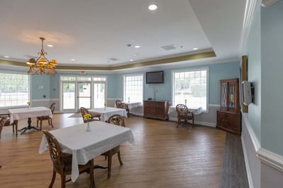 Bright dining room with tables set for meals
