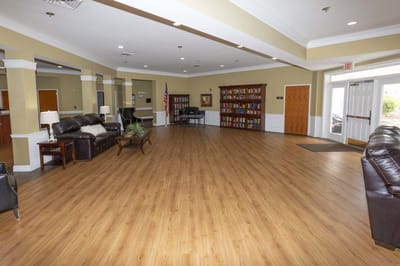 Bright interior view of a common area with seating and shelves