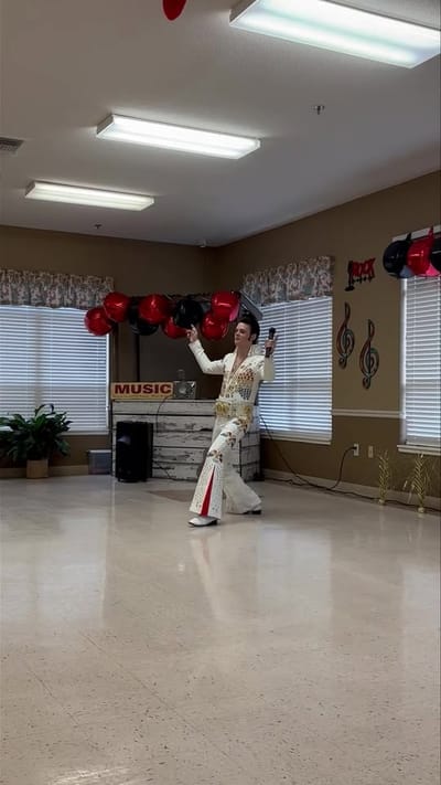 Resident performing at a community event with decorations