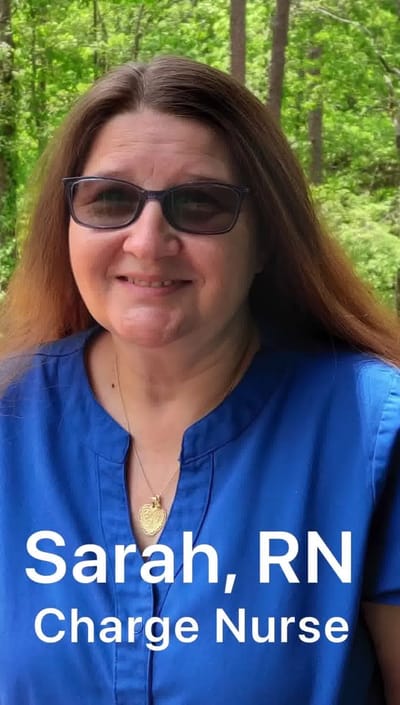 Nurse Sarah outdoors in a wooded area