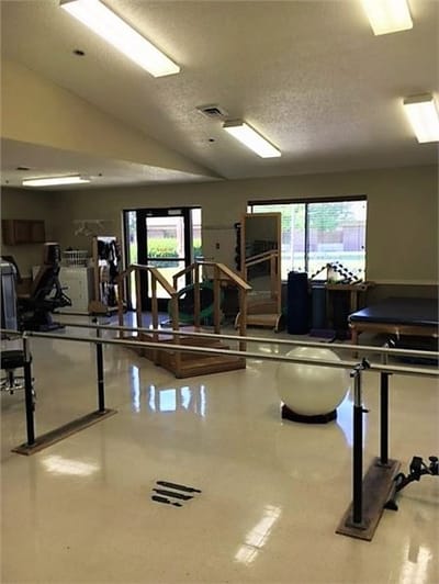 Rehabilitation area with exercise equipment and therapy tools