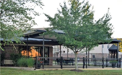 Exterior view of the facility with outdoor seating area