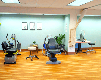 Rehabilitation area with exercise equipment and therapy stations