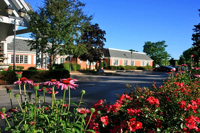 Exterior view of Care-Age Of Brookfield with flowers