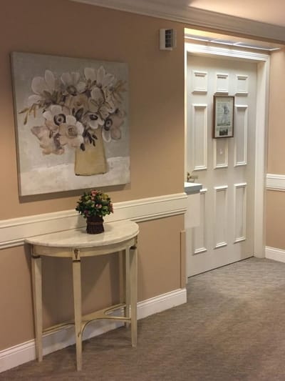 Interior hall with flower decoration and door